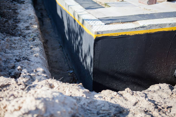Professional Waterproofing technician working in Bohemia, NY